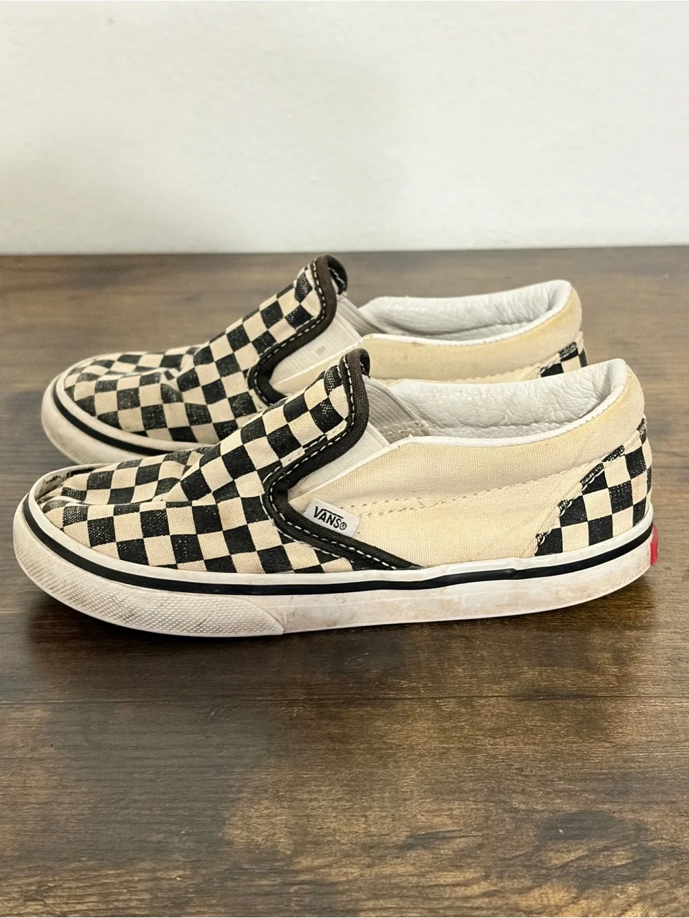 Vans Kids Slip-On Checkerboard Sneakers in Black and Cream